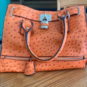 Elegant Orange Satchel with Lock Detail